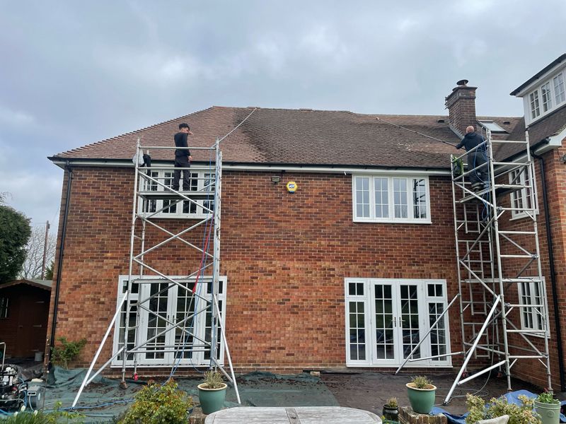 Roof cleaning carried out safely from scaffold towers by The Roof Moss Cleaners in East Grinstead